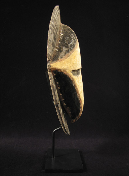 Oceanic Art - Wood yam mask, Abelam, Papua New Guinea, left