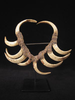 Oceanic Art - Boar's tusk mouth ornament, Papua New Guinea