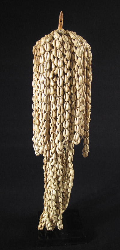 African Tribal Art - Cowrie shell shrine object, Yoruba, Nigeria, left