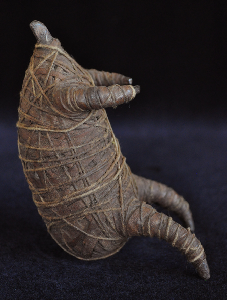 Effigy figure left