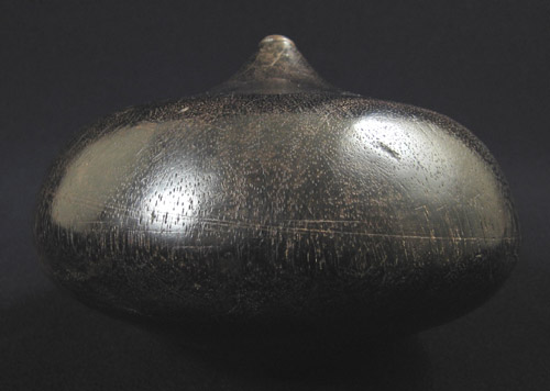 Indonesian Tribal Art - Wood throwing top, Borneo, Indonesia, side view